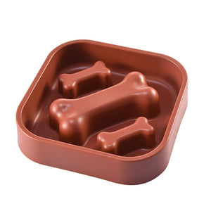 Brown silicone mold shaped like bones on a white background