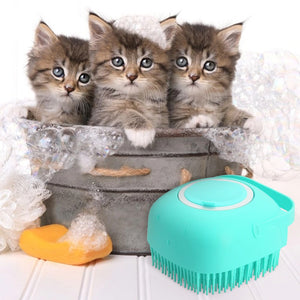 Three kittens in a basket with a teal pet grooming tool on a white background