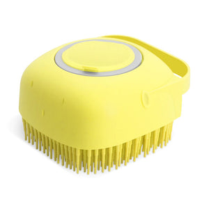 Yellow scalp massager on a white background