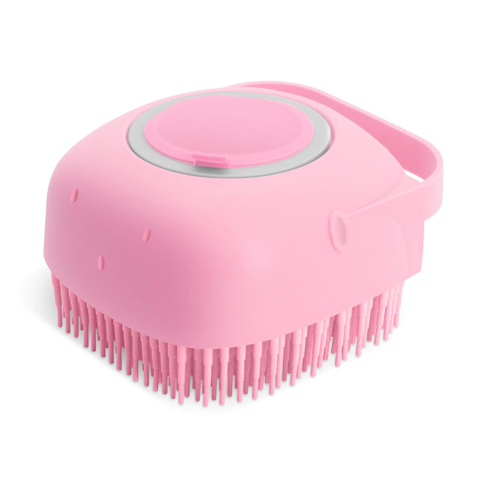 Pink silicone scrubber with bristles on a white background